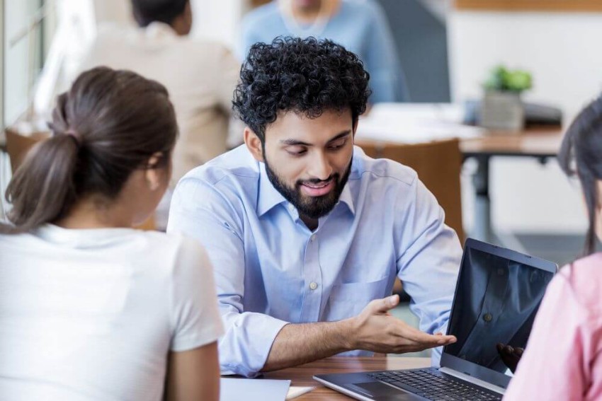 student smiling in a classroom